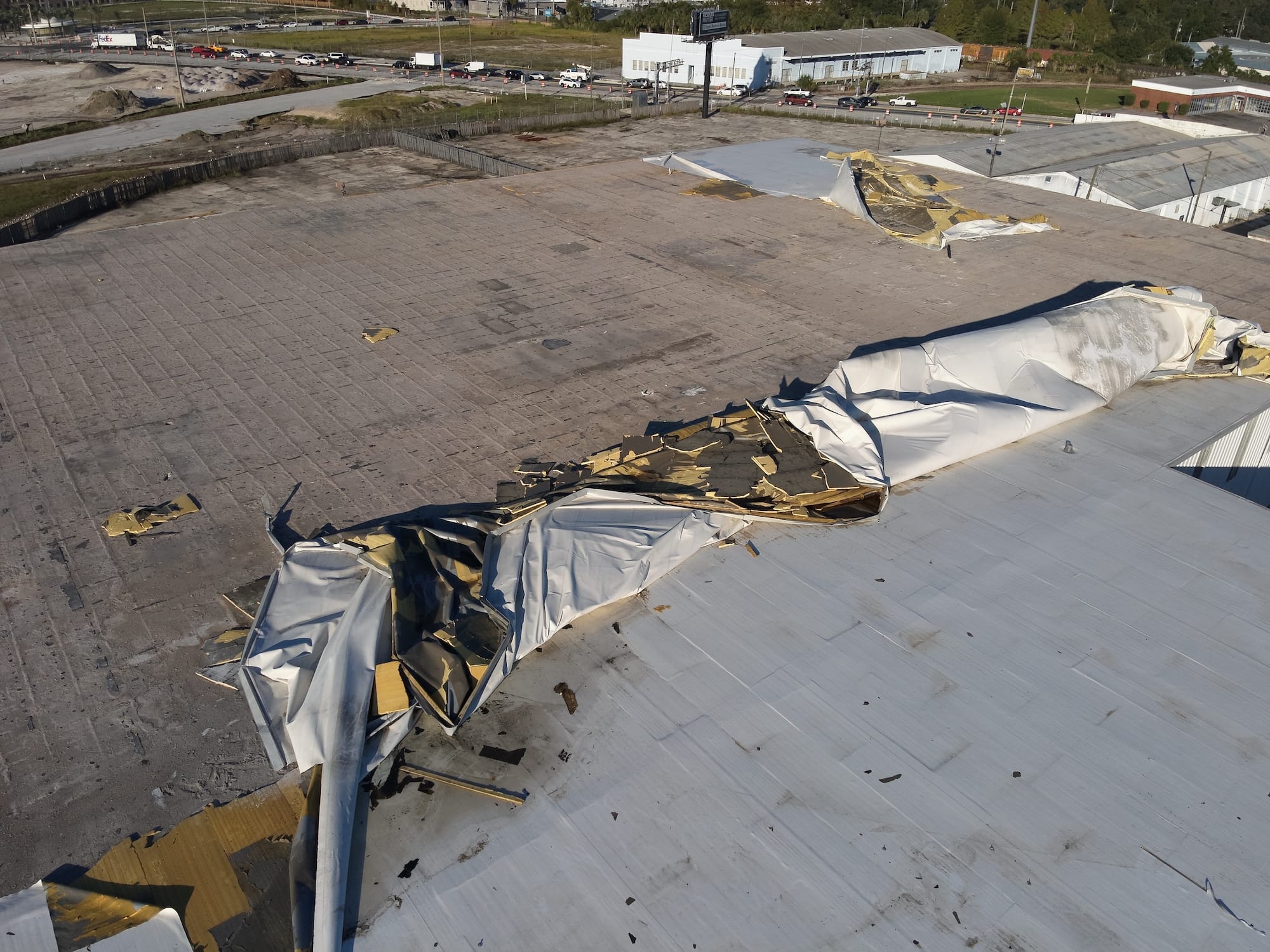 A highly damaged roof with an insurance claim.