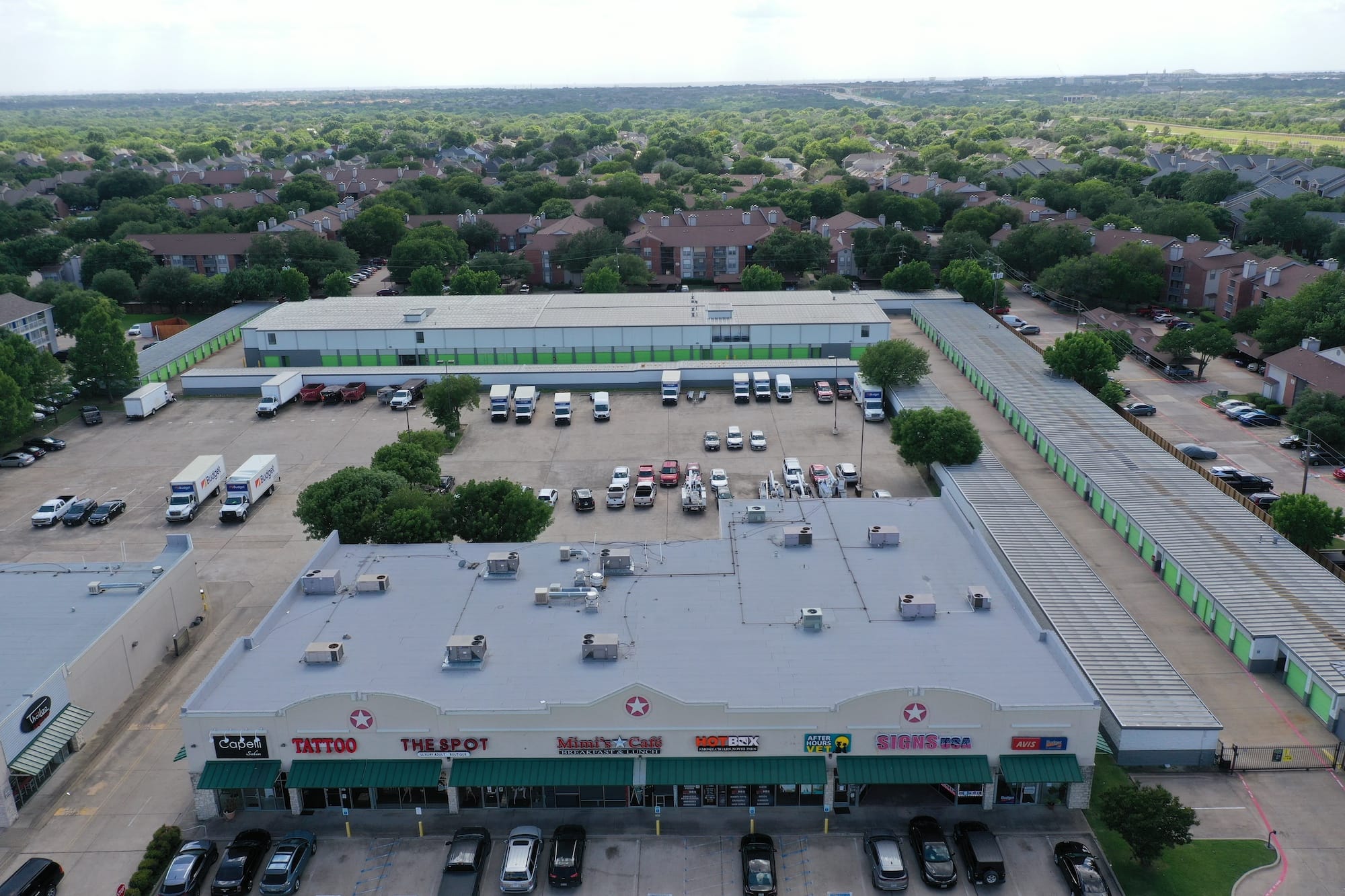 A commercial property roof and parking lot.