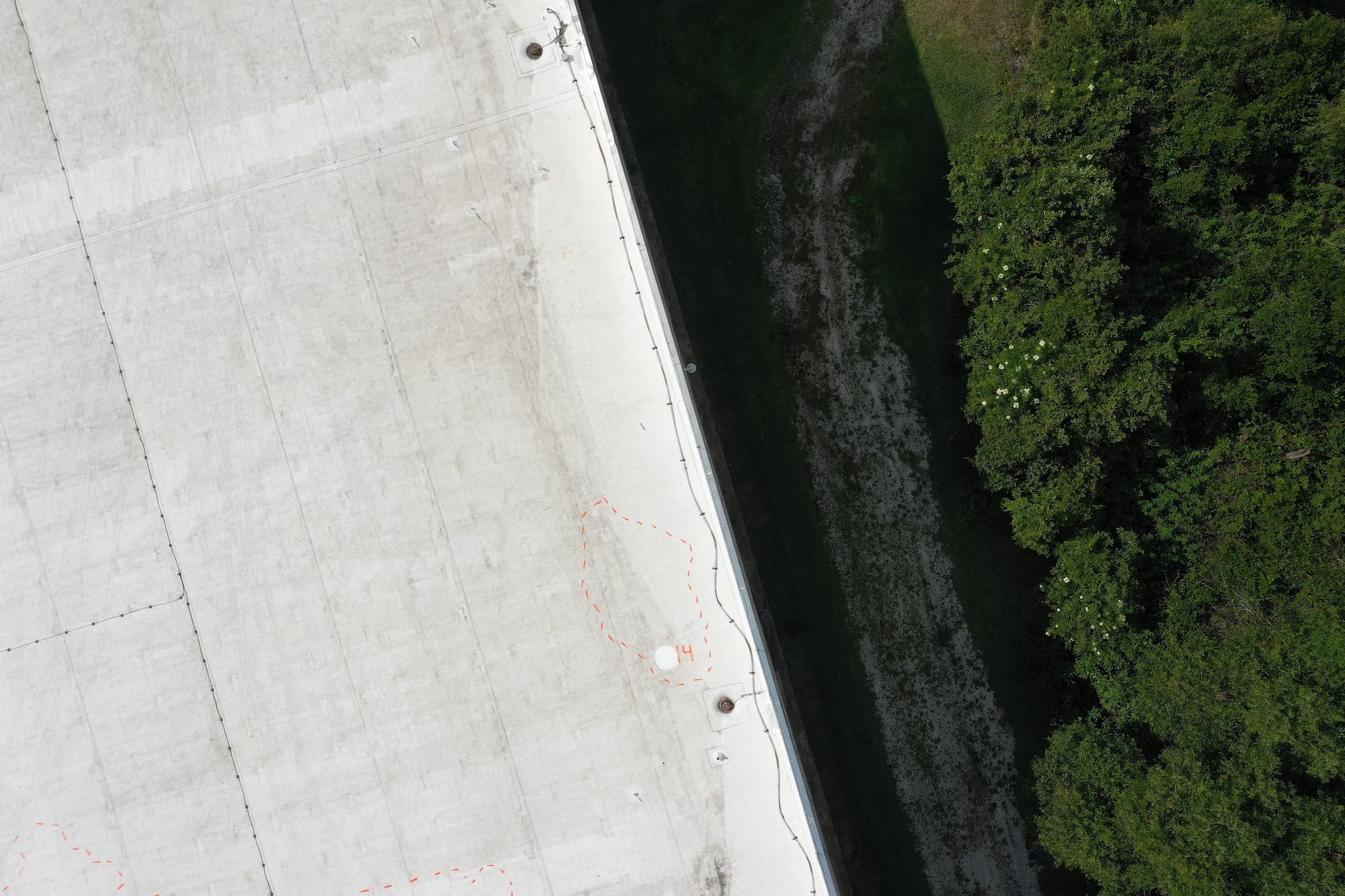 The corner of a roof with marked moisture spots.