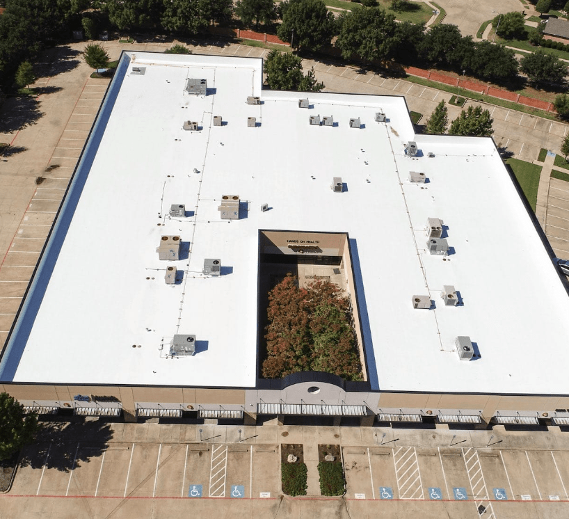 A clean roof being inspected by a drone.