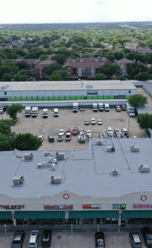 A commercial property roof and parking lot.