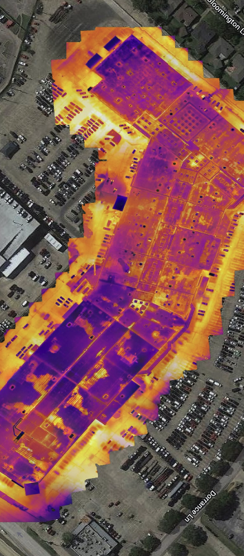 A layered thermal and visual image of a large commercial roof.