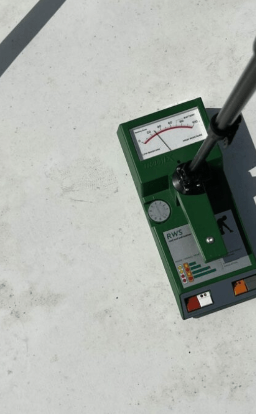 A moisture meter instrument on a commercial roof.