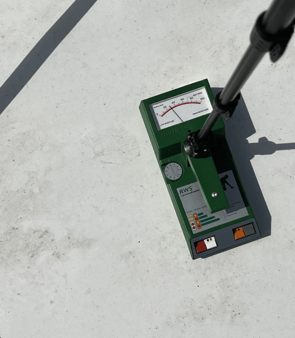 A moisture meter on a roof.
