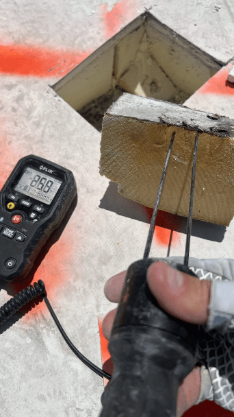 A test of moisture in a roof core sample.