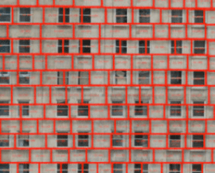 Many stitched-together drone shots of a commercial building facade.