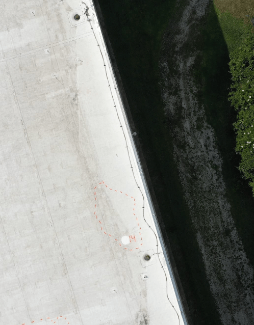 The corner of a roof with marked moisture spots.