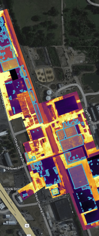 Thermal and visual aerial layering on commercial real estate building.