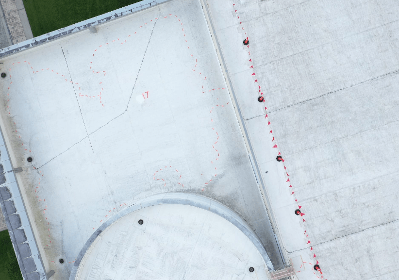 Visually mapped moisture damage on a commercial roof.